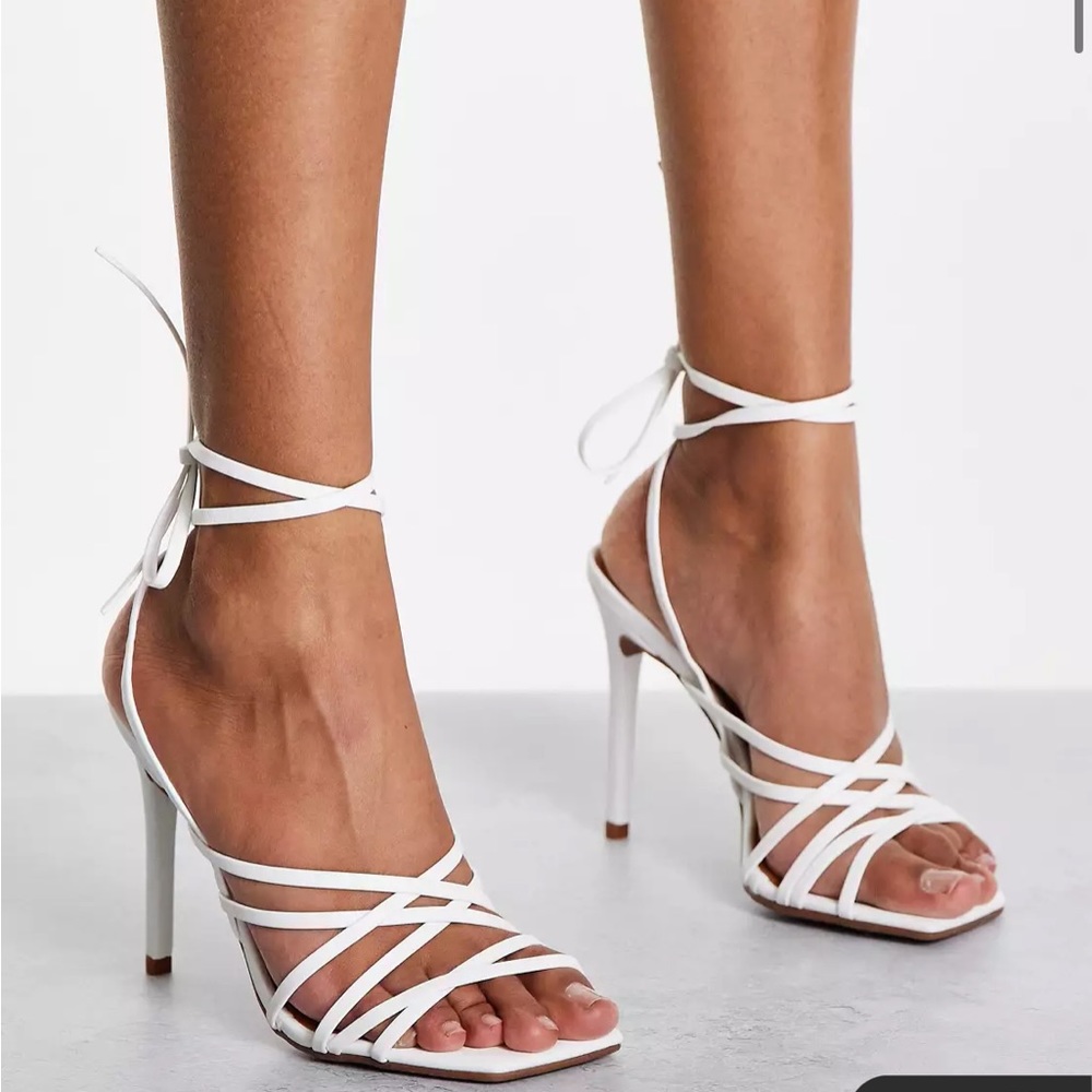 Strappy high heeled sandals in white